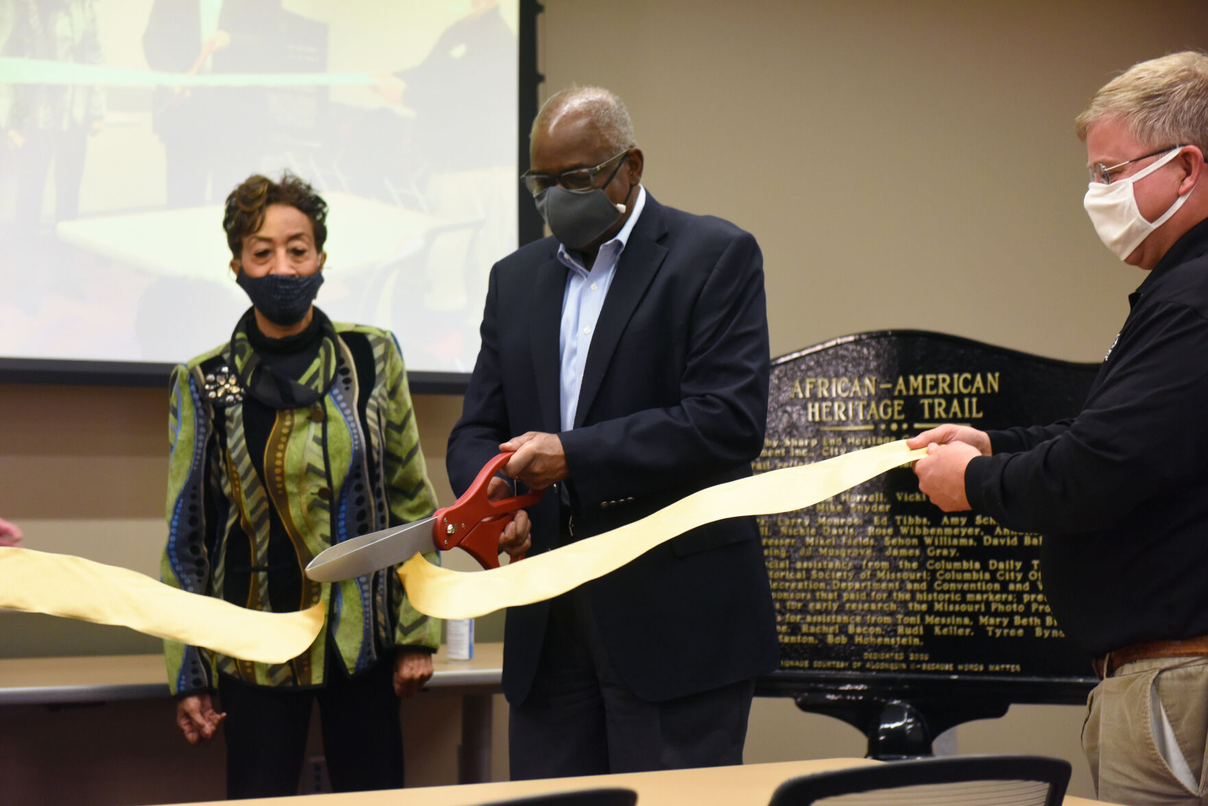 Jim Whitt cuts the ribbon